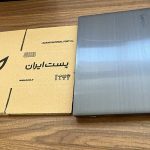 کارتن-پستی-در-کنار-لپ-تاپ-min